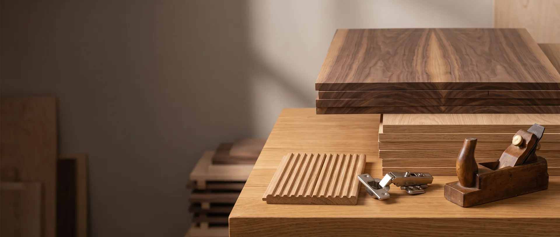 Walnut and oak veneer sheets on a workshop bench