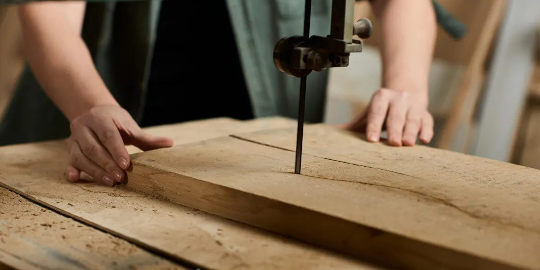 Cutting a solid wood panel in the DWC Millwork factory