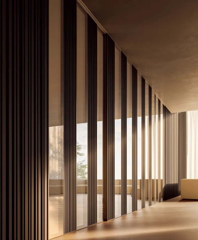 Fluted walnut wall panels along a hallway